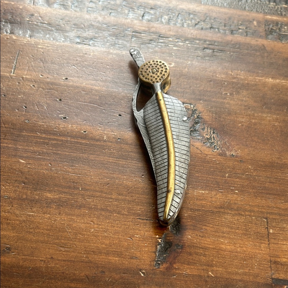 Unique Damascus friction folder knife